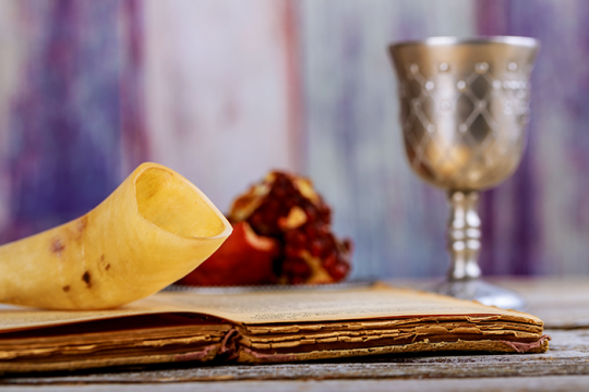 Photo of a shofar, kiddish cup and old prayer book