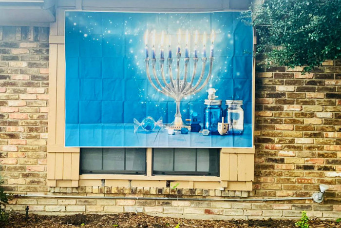 Hanukkah sign on the side of a house