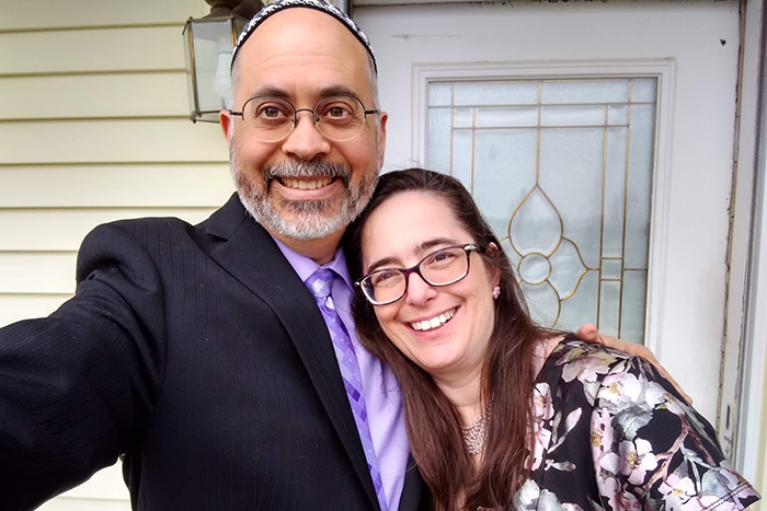 Josh Rodriguez and his wife Laurie taking a selfie in front of their house