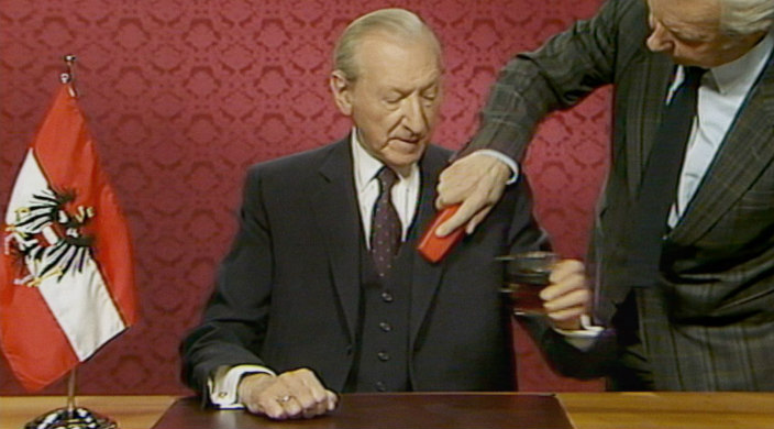 Still from the film featuring Waldheim appearing on Austrian national TV