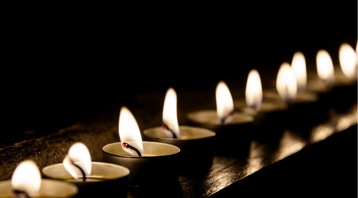 row of short candles with flames