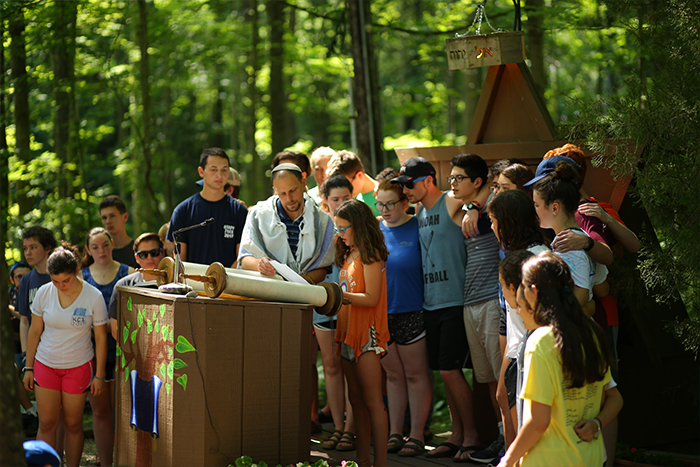 campers reading from the Torah at Shabbat service at URJ Goldman Union Camp Institute - GUCI