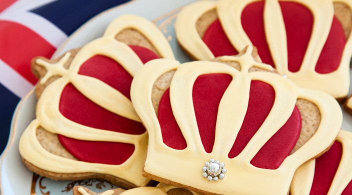 Royal wedding cookies on a plate with the British flag in the background