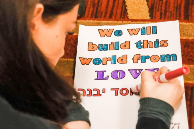 Girl writing on a poster