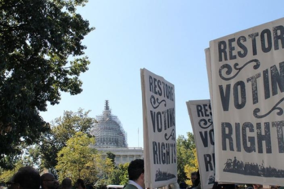 Signs that say "restore voting rights"