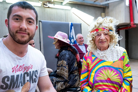 adapt a safta purim party volunteer daniel andhis adapted surviror grandmother luba