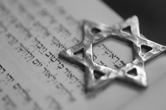 star of david resting on a prayer book