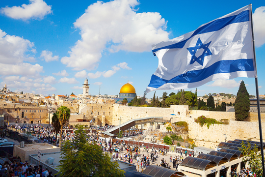 an image of an Israeli flag and the Western Wall in Israel