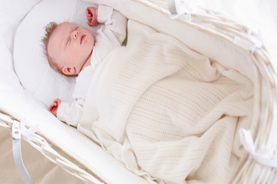 baby in a bassinet 